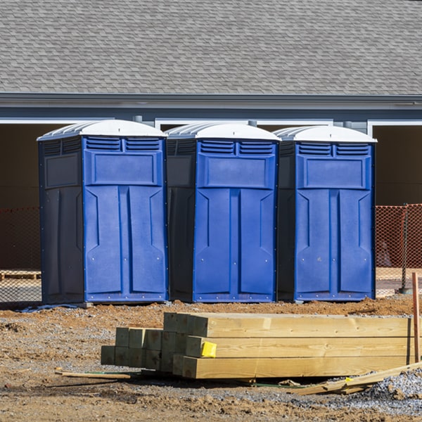 what is the cost difference between standard and deluxe portable restroom rentals in Cross Timber